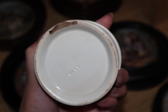 A group of Prattware plates, a mug and pot lids